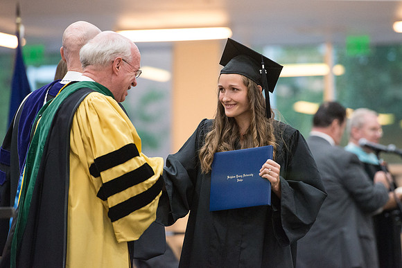 Elder Cornish and President Eyring congratulate graduates. Convocation for Foundations and Interdisciplinary Studies graduates. July 2017