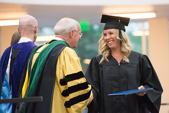 Elder Cornish and President Eyring congratulate graduates. Convocation for Foundations and Interdisciplinary Studies graduates. July 2017