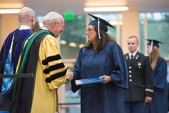 Elder Cornish and President Eyring congratulate graduates. Convocation for Foundations and Interdisciplinary Studies graduates. July 2017