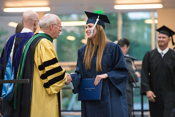 Elder Cornish and President Eyring congratulate graduates. Convocation for Foundations and Interdisciplinary Studies graduates. July 2017