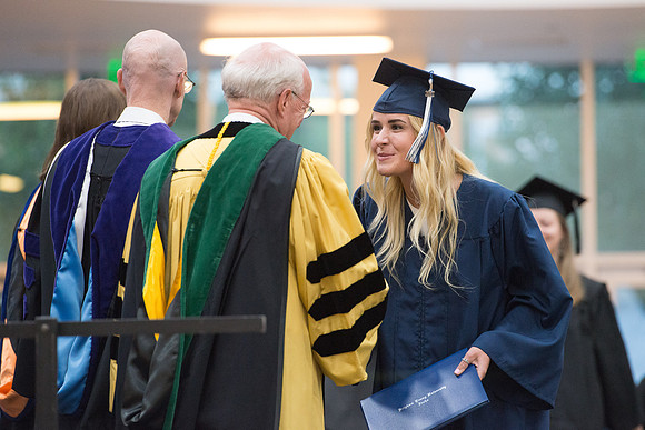 Elder Cornish and President Eyring congratulate graduates. Devanie Teeter from Rigby, ID graduates and is called to serve in the Uraguay Mission. Convocation for Foundations and Interdisciplinary Stud