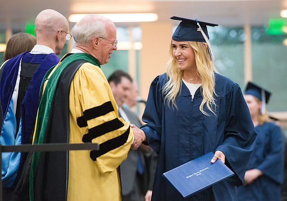 Elder Cornish and President Eyring congratulate graduates. Devanie Teeter from Rigby, ID graduates and is called to serve in the Uraguay Mission. Convocation for Foundations and Interdisciplinary Stud