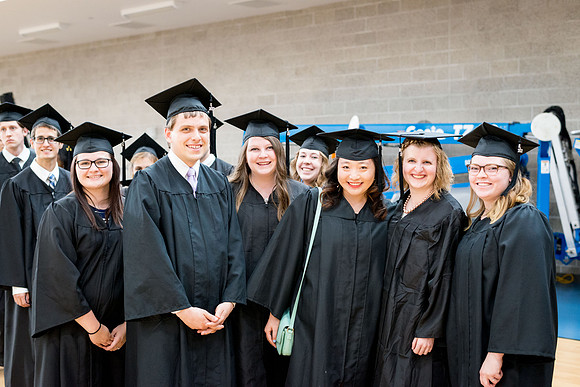 Students gather together before Commencement
