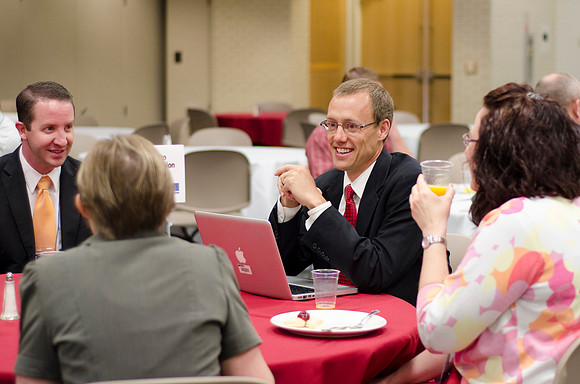 Online instructors gather for breakfast and instruction.