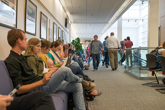 Students on their way to and from class in the Thomas E Ricks Building at the start of Fall semester 2016.