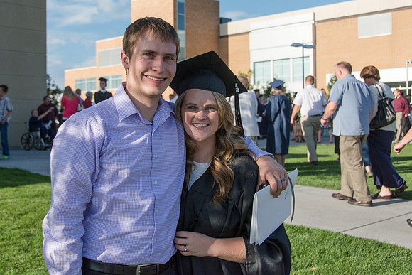 Faculty, family and graduates around campus after the commencement ceremony.