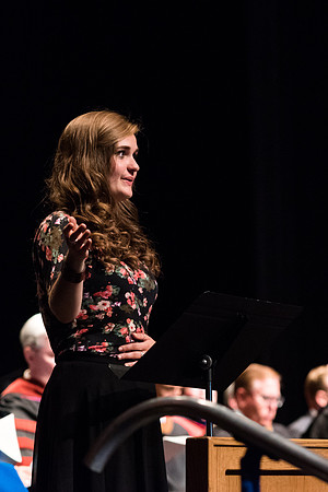 A students conducts the music at the convocation for Business and Communications graduates. 2017