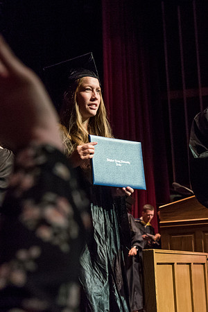 Business and Communications graduates recieve their diplomas at the Spring Convocation. 2017