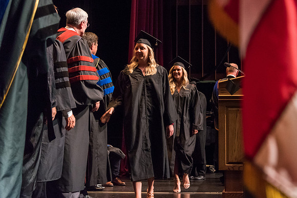Business and Communications graduates recieve their diplomas at the Spring Convocation. 2017