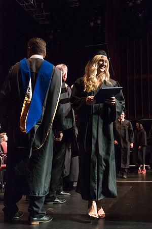 Business and Communications graduates recieve their diplomas at the Spring Convocation. 2017