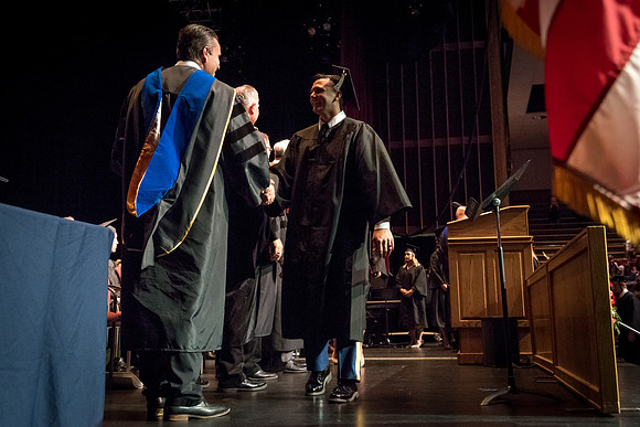 Business and Communications graduates recieve their diplomas at the Spring Convocation. 2017