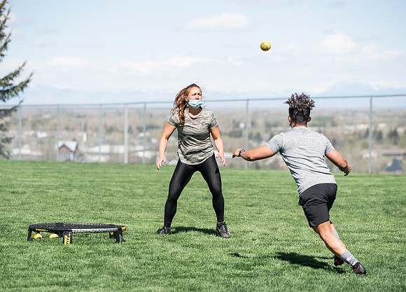 Student teams compete in BYUI's spikeball tournament held in the upper fields.