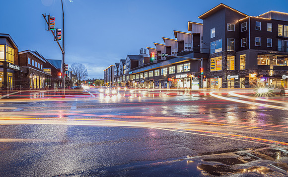 The Cedars apartment complex at night during a rain storm.