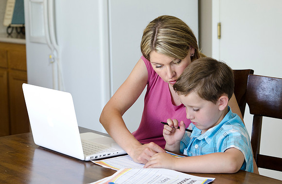 Kati is able to study for her online classes while still caring for her children.