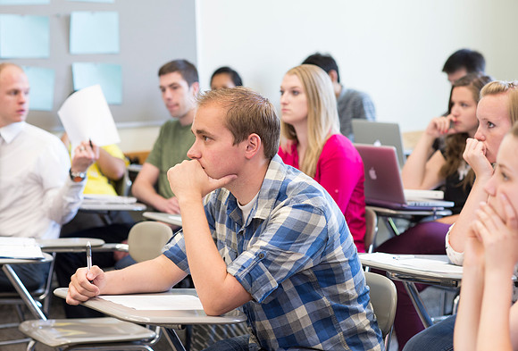 Sister Brooke McKenna teaches students in a communication class.