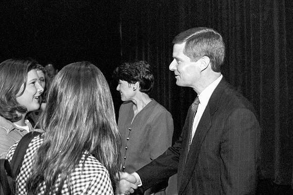 President David A. Bednar and Sister Bednar meeting with members of the audience.