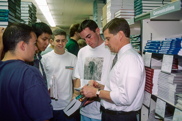 President Bednar helping students find their books for the new semester