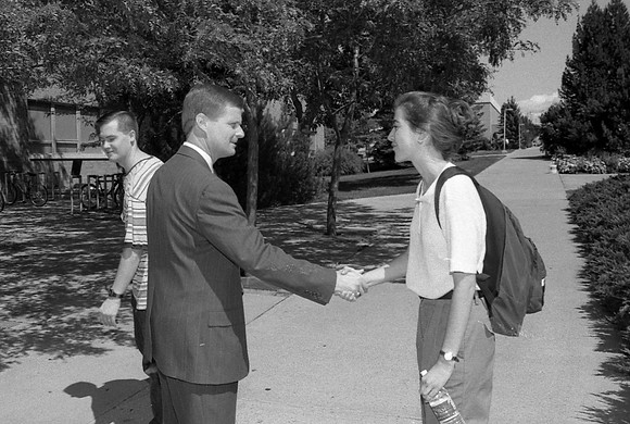 President Bednar greets students out on campus.