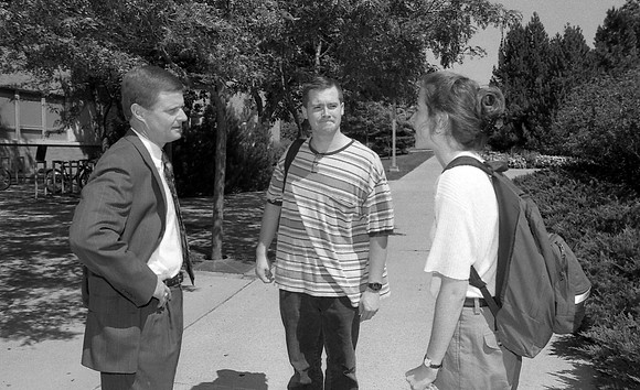 President Bednar greets students out on campus.