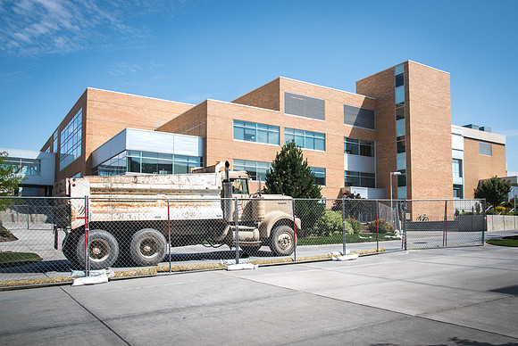 A truck drives down the sidewalk by the Manwaring Center as part of the construction on campus. 2017
