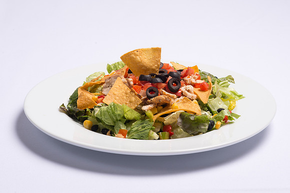 BYU-Idaho Food Service Catering. Southwest Salad Fresh mixed Salad Greens, topped with marinated sliced Chicken Breast, chopped Vegetables, Tomatoes, shredded Cheddar Cheese and Tortilla Chips. Served