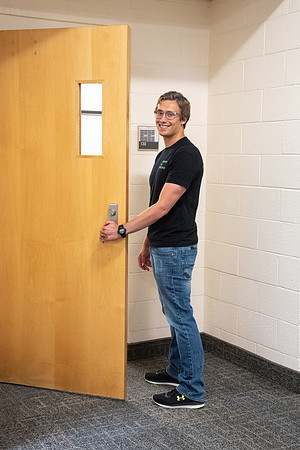 Examples of students staying safe and healthy during the COVID-19 pandemic by social distancing, following pathway arrows, and wearing face masks.