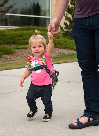 Cute little one year old Katherina Gant holding her dad's hand. She is the daughter of Levi and Tyler Gant.
