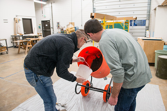 Civil engineering students work with different mixtures of cement to make a light, yet durable, cement that will be the building material for a canoe.
