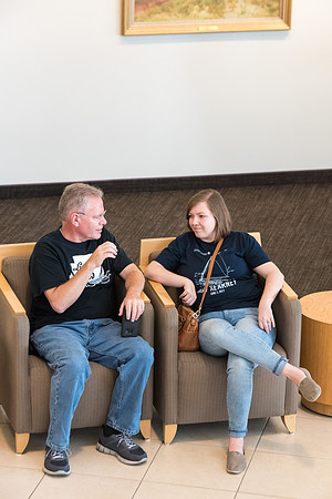 Student and parent sit and chat about the upcoming adventures at BYU-Idaho.