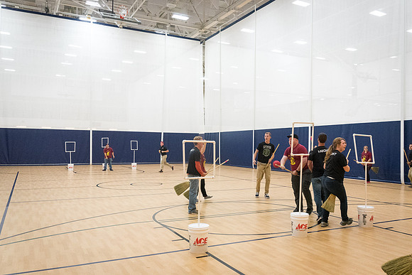 Students play a game of Quidditch, inspired by a sport from Harry Potter.