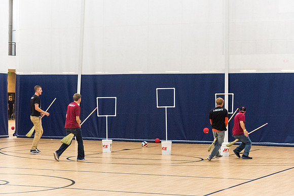 Students play a game of Quidditch, inspired by a sport from Harry Potter.