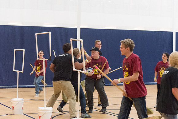 Students play a game of Quidditch, inspired by a sport from Harry Potter.
