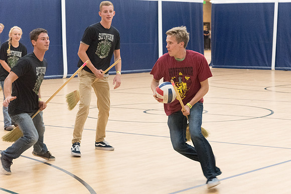 Students play a game of Quidditch, inspired by a sport from Harry Potter.
