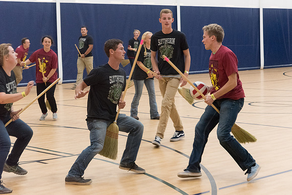 Students play a game of Quidditch, inspired by a sport from Harry Potter.