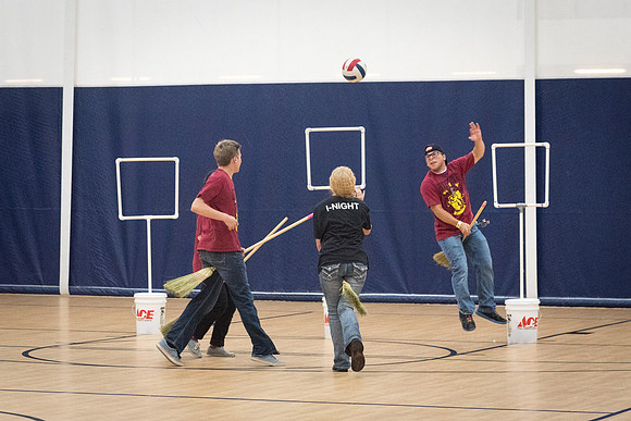 Students play a game of Quidditch, inspired by a sport from Harry Potter.
