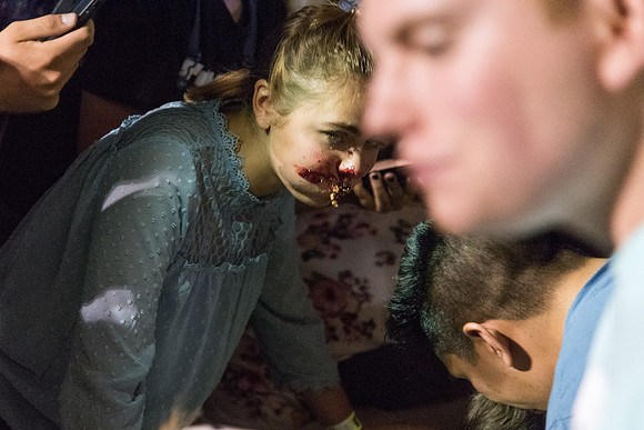 Students participate in a pie eating contest. Each pie is to be eaten by a team of three students who can only use their mouths to eat pies.