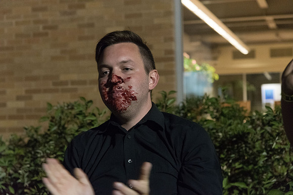 Students participate in a pie eating contest. Each pie is to be eaten by a team of three students who can only use their mouths to eat pies.