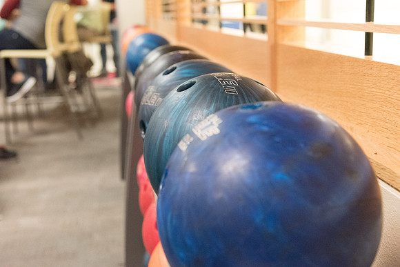 The bowling alley is open during I-Night and students enjoy themselves bowling.