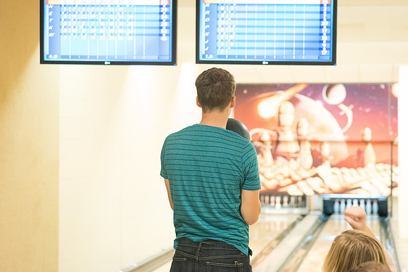 The bowling alley is open during I-Night and students enjoy themselves bowling.