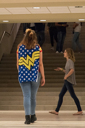 A girl in a Wonder Woman cape.
