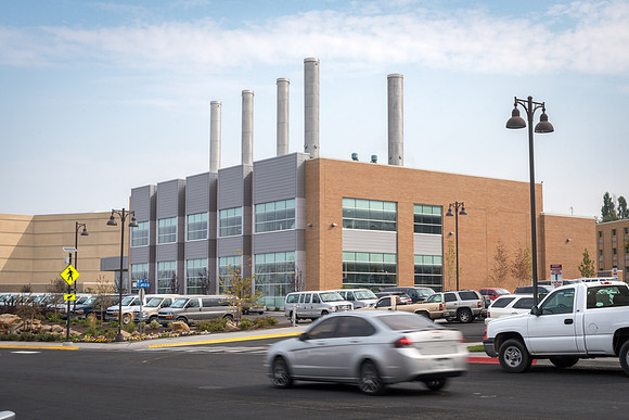 Cars pass the Energy Facility at the start of the Fall 2017 Semester.