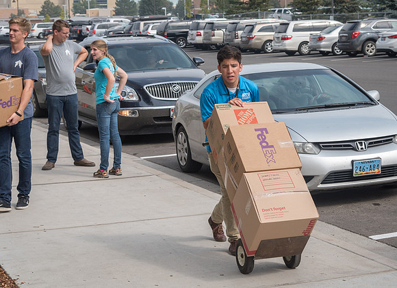 Many student volunteers help other students move in at the start of the semester.