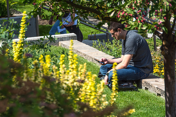 A student sits out the in sun during the first week of school.
