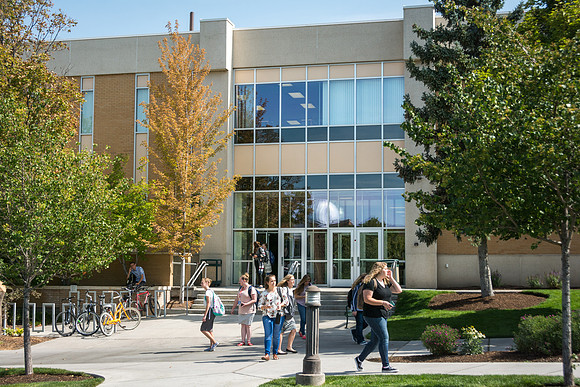 Students walk by the Clarke Building on the first week of school.