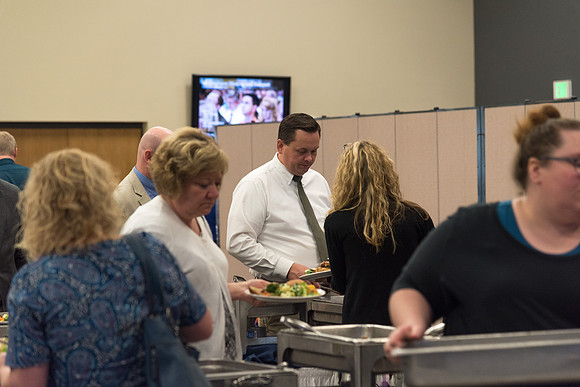 Employees get their food that has been prepared by Food Services before the start of the banquet. 2017
