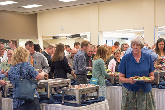 Employees get their food that has been prepared by Food Services before the start of the banquet. 2017