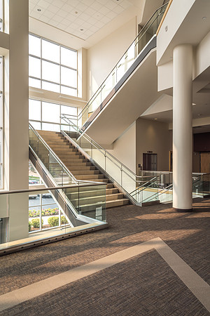 The stairways in the I-Center are lit up as morning light floods in the windows.