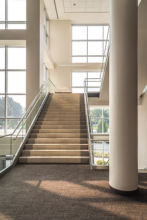The stairways in the I-Center are lit up as morning light floods in the windows.