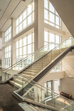 The stairways in the I-Center are lit up as morning light floods in the windows.