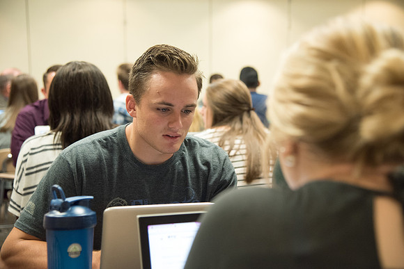 Students learn about College Success from Mark Orchard and their classmates through group discussions.